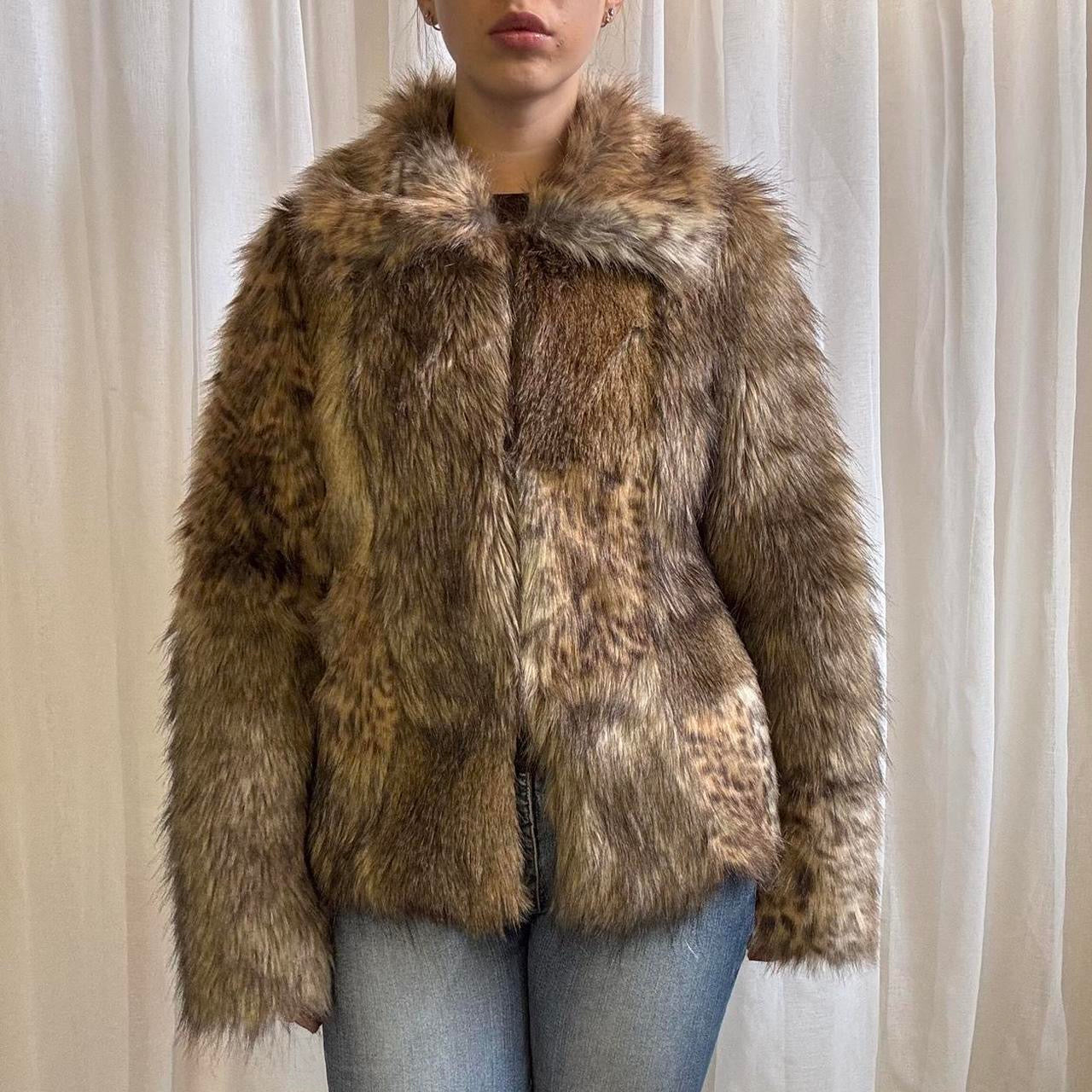 Model wearing a brown faux fur animal print Y2K coat by Warehouse, size UK 10